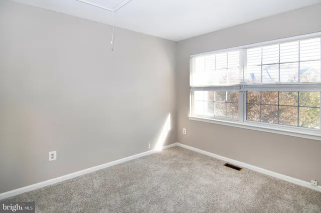 an empty room with closet area