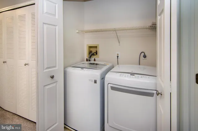a bathroom with a granite countertop toilet a sink and a bathtub