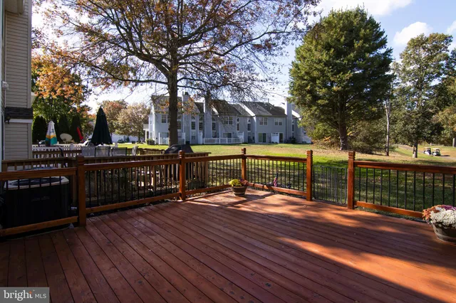 a view of deck with wooden floor and outdoor seating