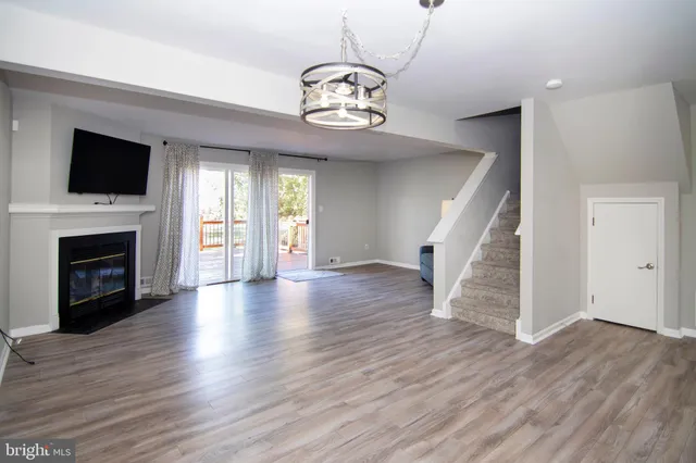 a room with furniture and wooden floor