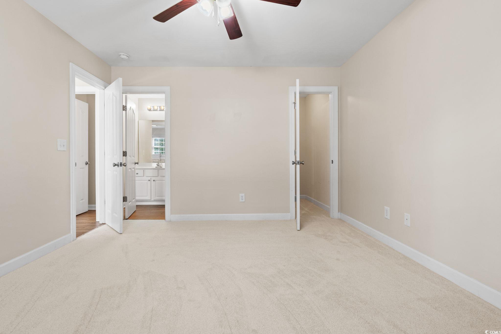 181 Dunbarton Lane Conway, SC 29526 - Photo 15 of 40 Unfurnished bedroom featuring light carpet, ceiling fan, and ensuite bathroom