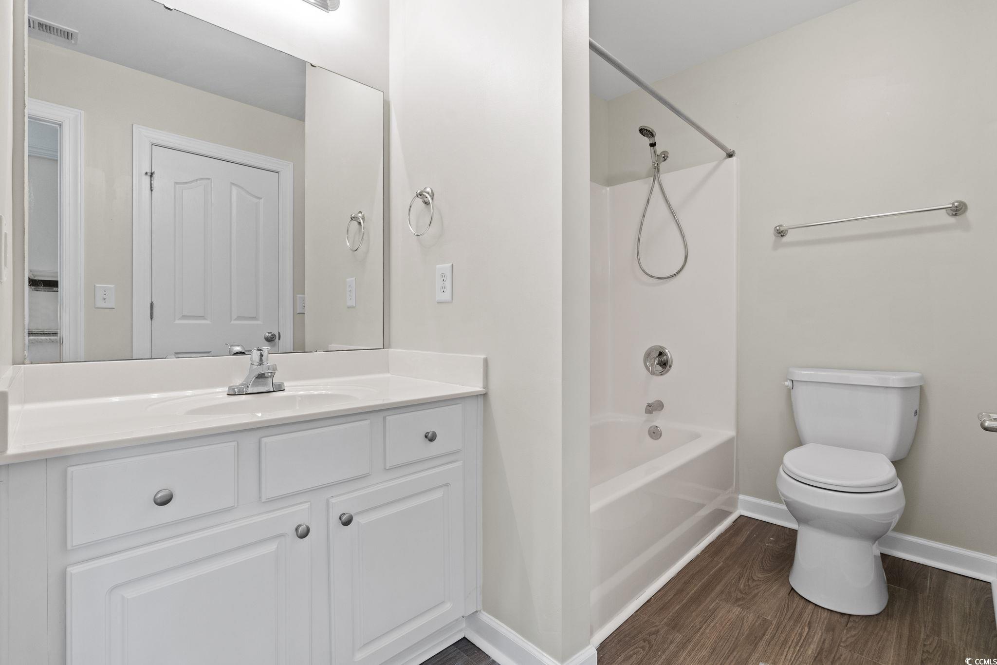 181 Dunbarton Lane Conway, SC 29526 - Photo 16 of 40 Full bath featuring shower / bath combination, vanity, and dark wood-style floors