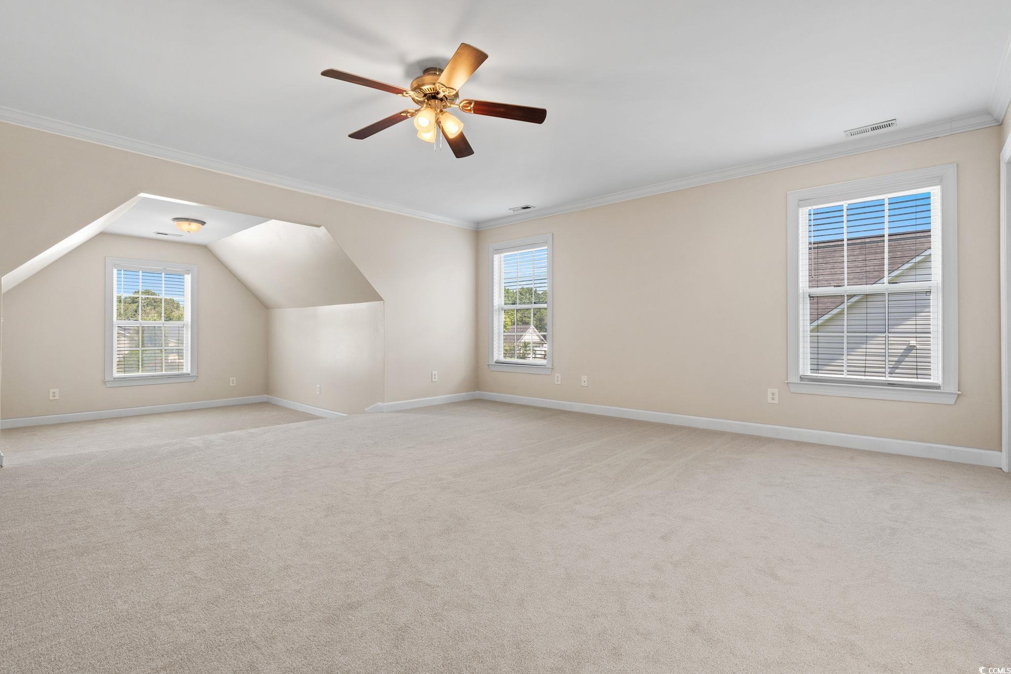181 Dunbarton Lane Conway, SC 29526 - Photo 19 of 40 Bonus room featuring healthy amount of natural light, light carpet, a ceiling fan, and vaulted ceiling
