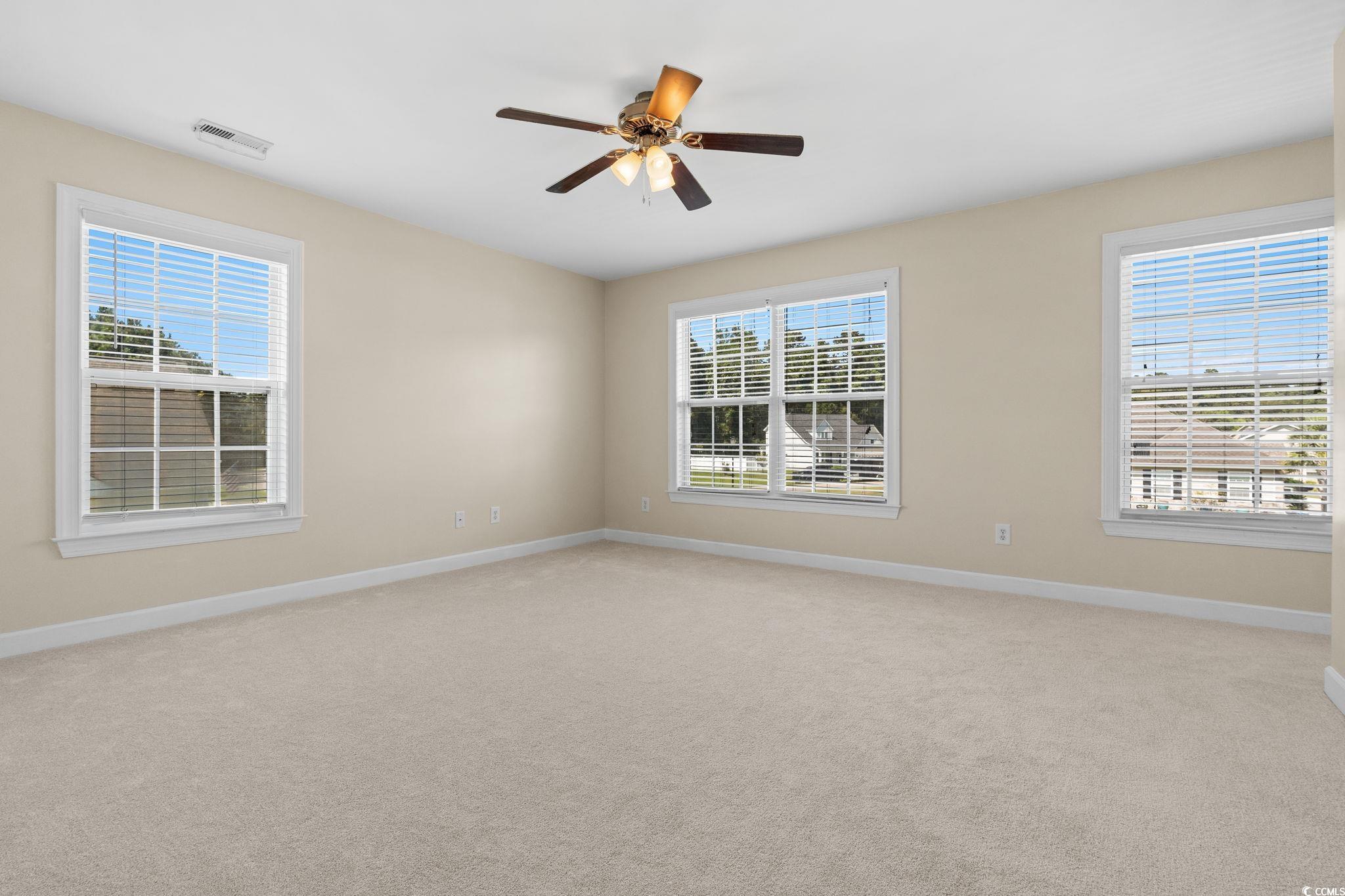 181 Dunbarton Lane Conway, SC 29526 - Photo 27 of 40 Spare room featuring plenty of natural light, light colored carpet, and a ceiling fan