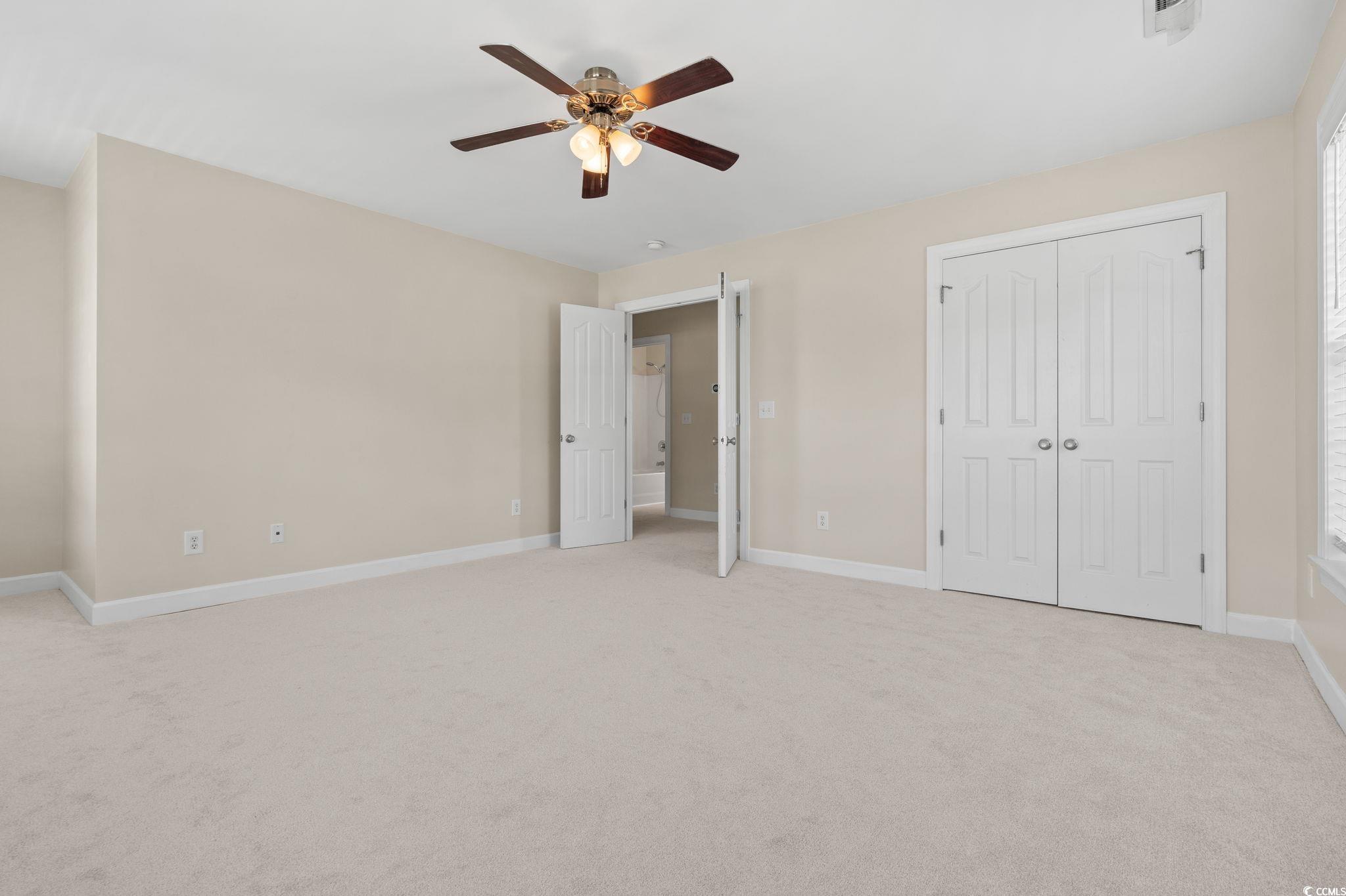 181 Dunbarton Lane Conway, SC 29526 - Photo 28 of 40 Unfurnished bedroom featuring light carpet, a ceiling fan, and a closet