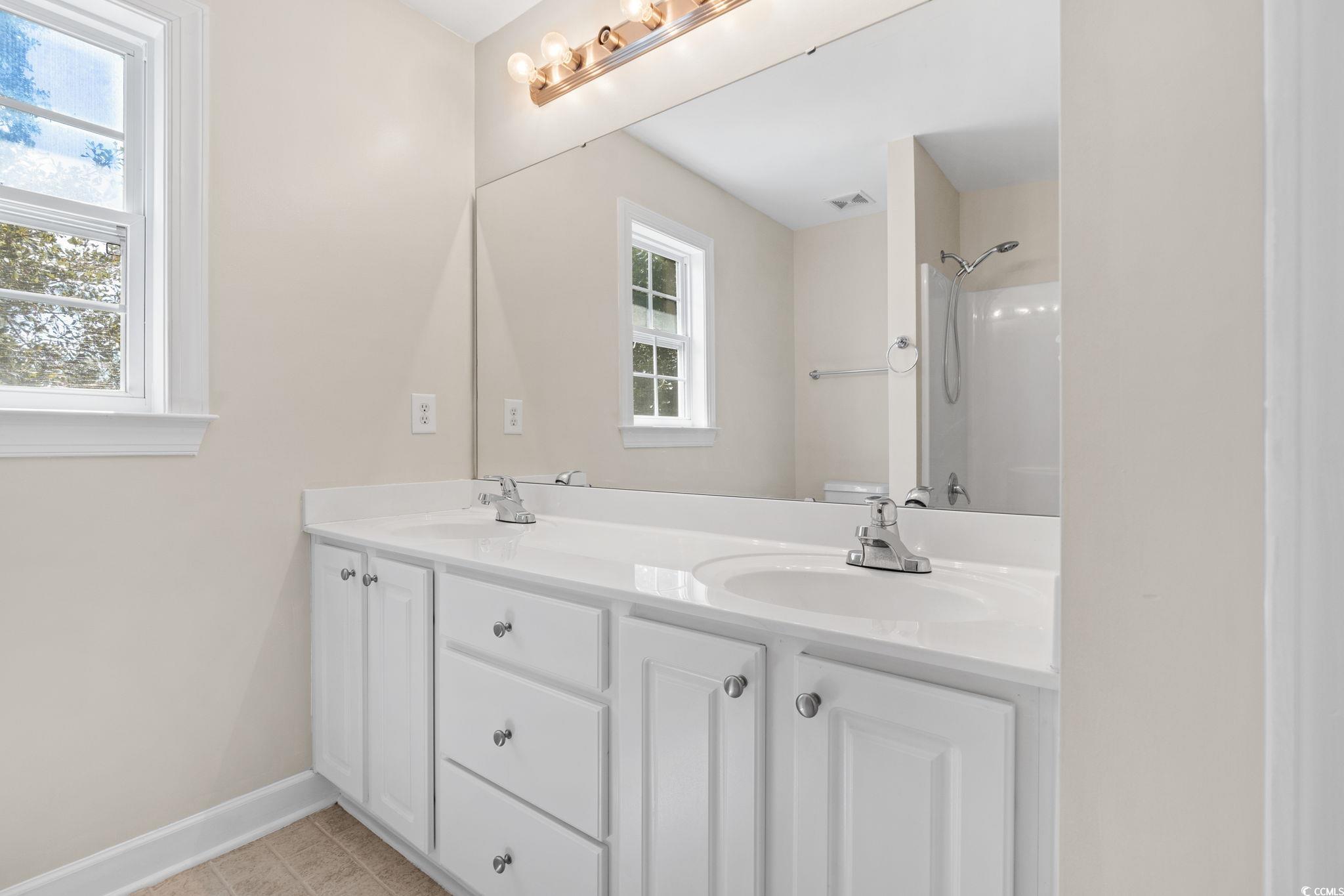181 Dunbarton Lane Conway, SC 29526 - Photo 30 of 40 Full bathroom featuring plenty of natural light, double vanity, and a shower
