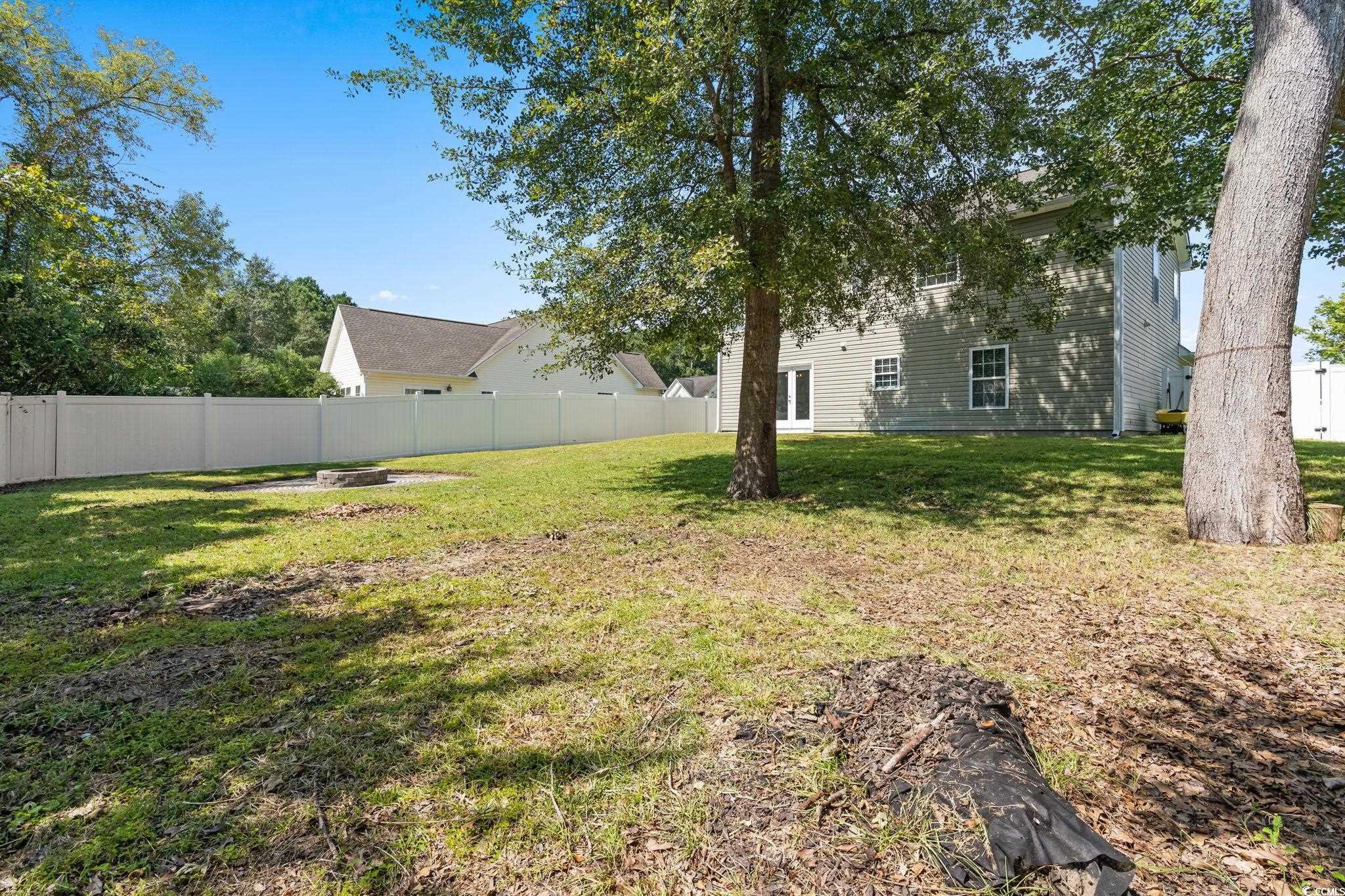 181 Dunbarton Lane Conway, SC 29526 - Photo 39 of 40 Fenced backyard with a fire pit