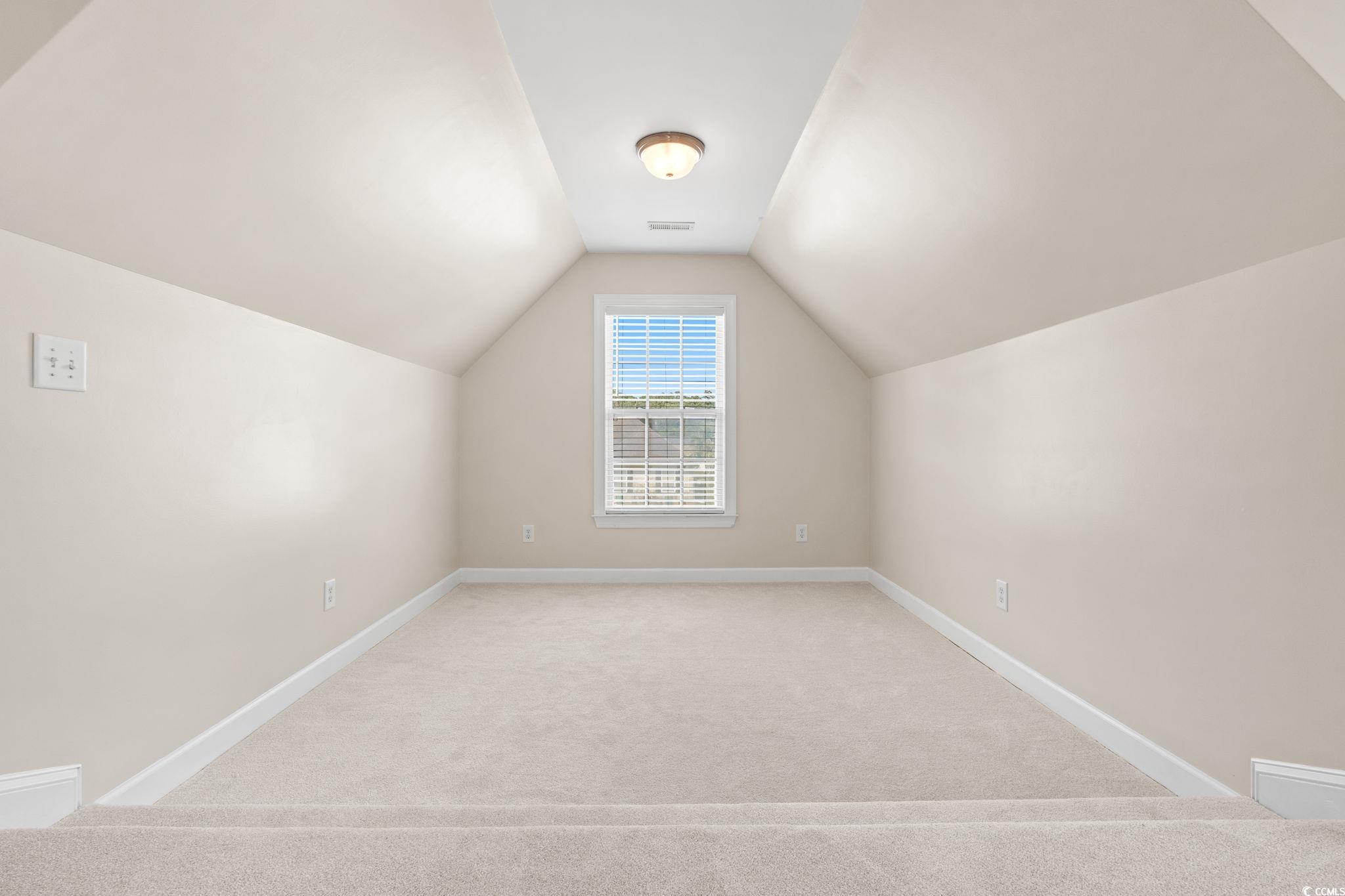 181 Dunbarton Lane Conway, SC 29526 - Photo 5 of 40 Bonus room with light carpet and vaulted ceiling