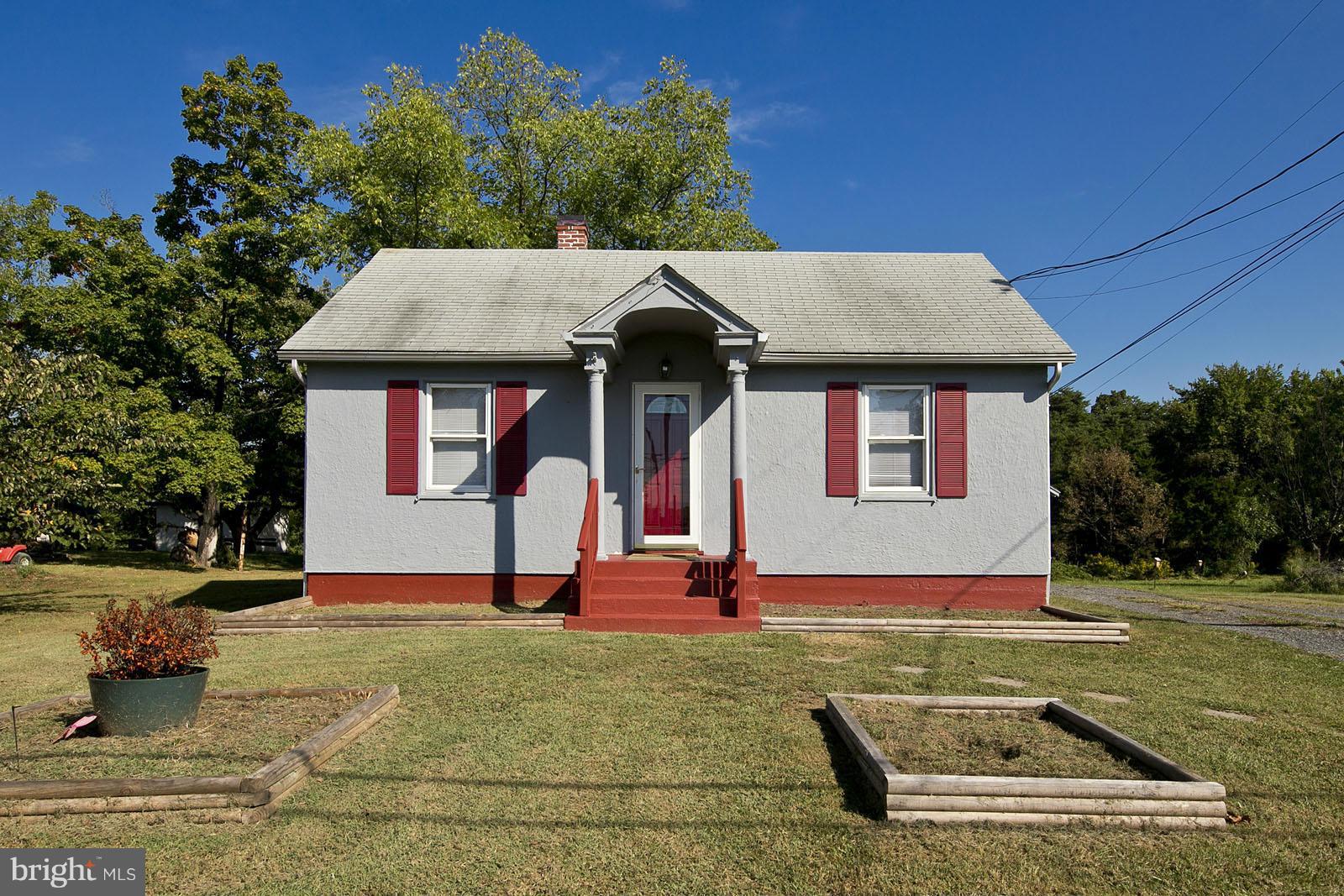 2244 Strasburg Road Front Royal, VA 22630 - Photo 2 of 30 a house view with a garden space