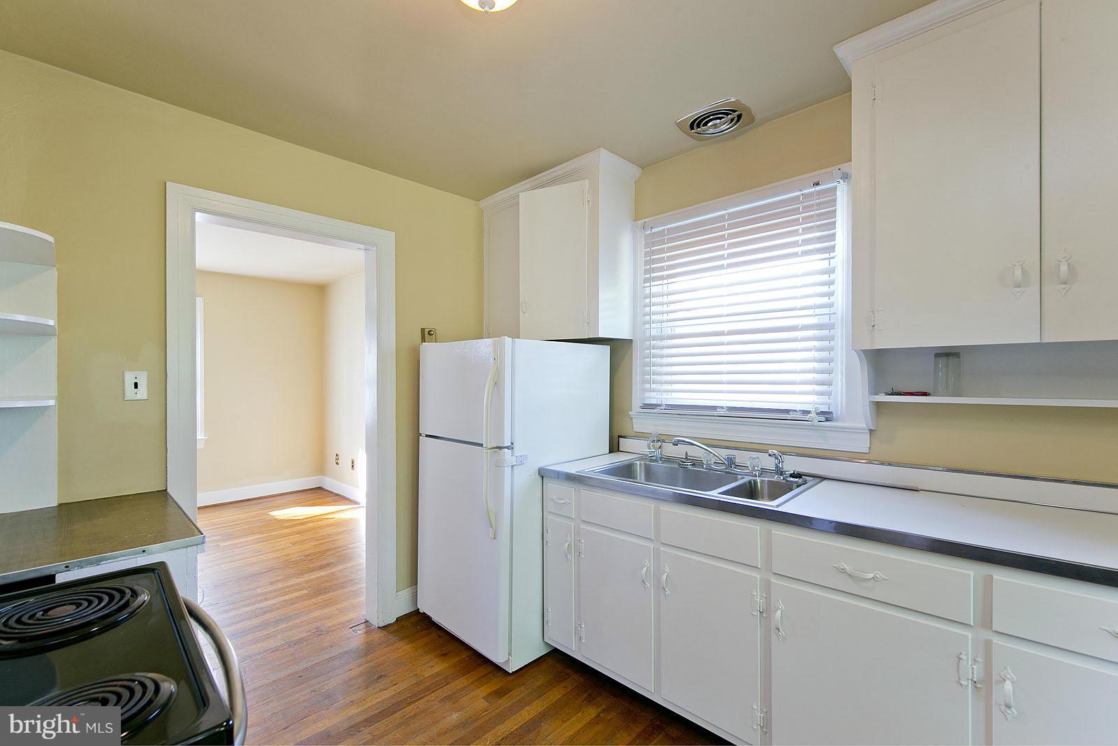 2244 Strasburg Road Front Royal, VA 22630 - Photo 12 of 30 a kitchen with a refrigerator and a sink