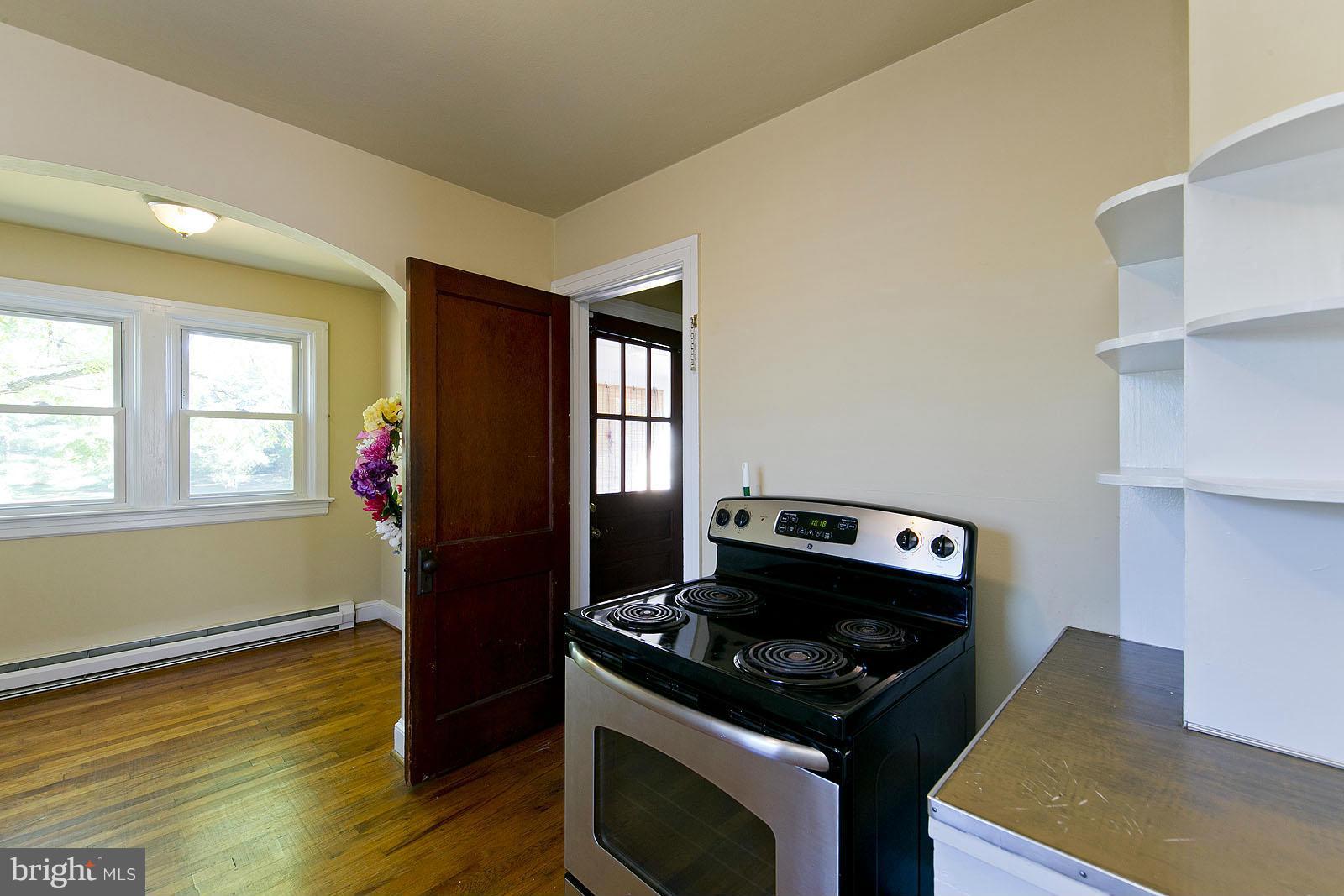 2244 Strasburg Road Front Royal, VA 22630 - Photo 13 of 30 a kitchen with a stove and a microwave