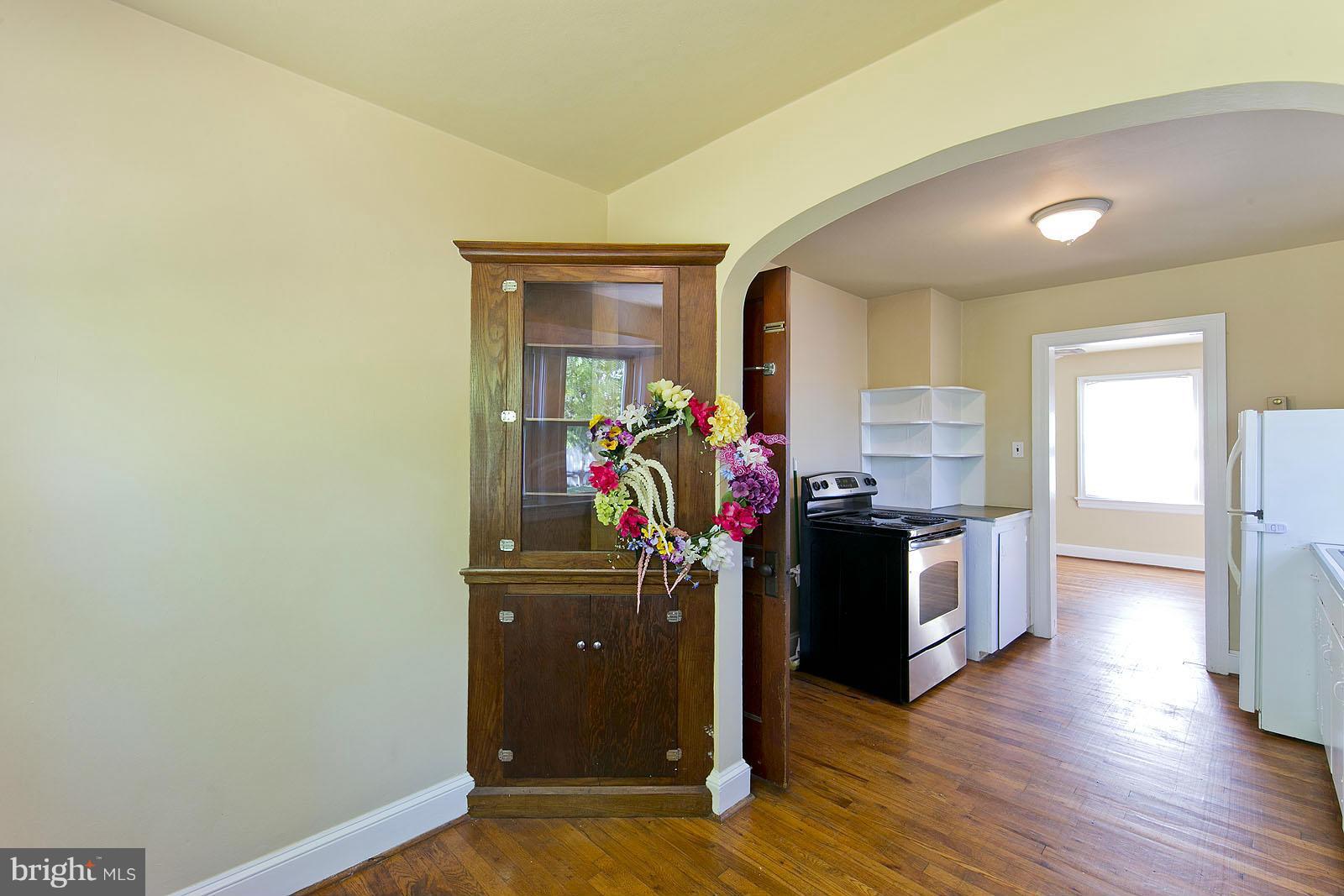 2244 Strasburg Road Front Royal, VA 22630 - Photo 15 of 30 a view of a kitchen with fridge and wooden floor