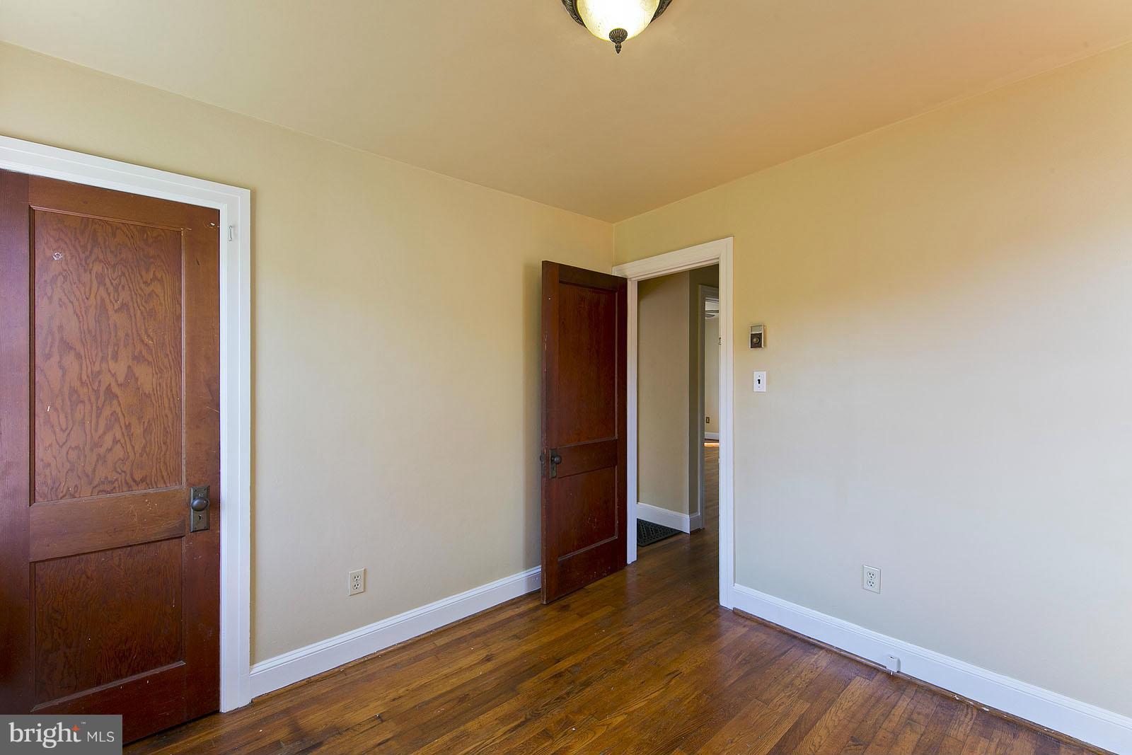 2244 Strasburg Road Front Royal, VA 22630 - Photo 22 of 30 a view of an empty room with wooden floor and closet