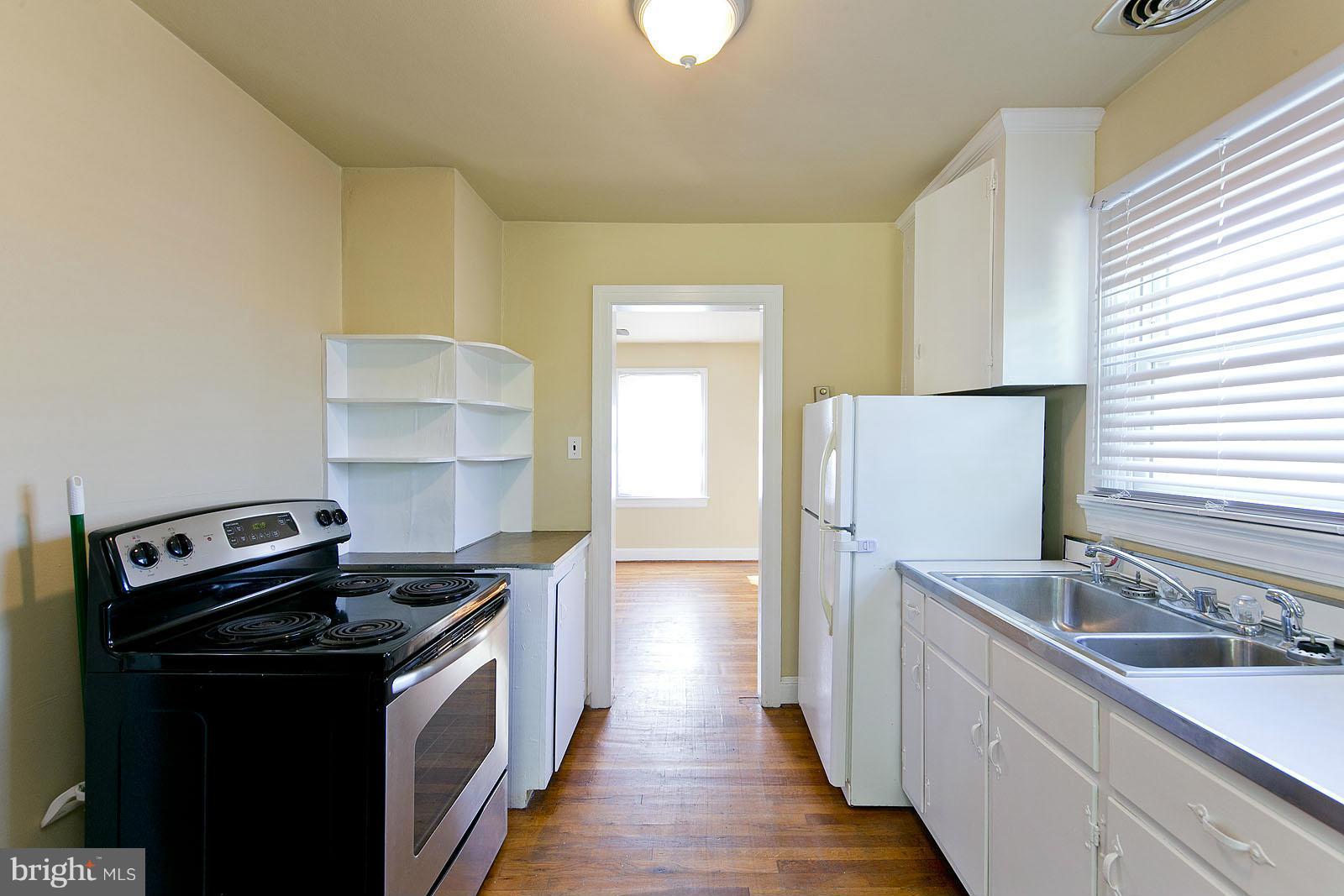 2244 Strasburg Road Front Royal, VA 22630 - Photo 10 of 30 a kitchen with a sink stove and refrigerator