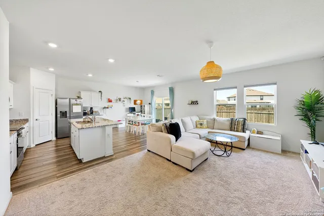 a living room with furniture and a table