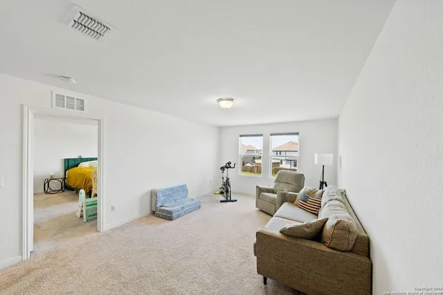 a living room with furniture and a window