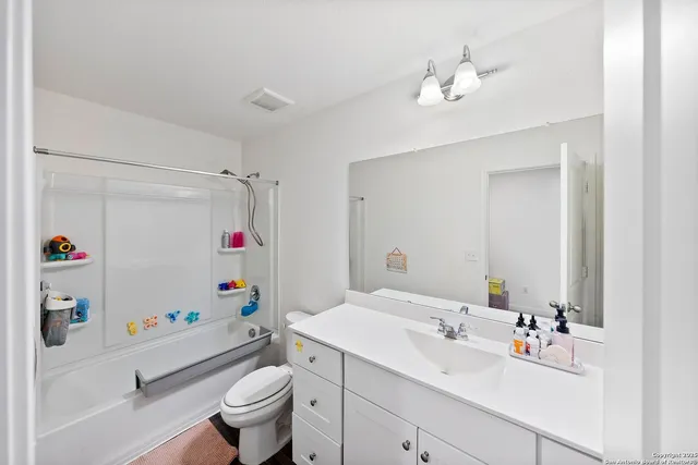 a view of living room filled with furniture and a couch