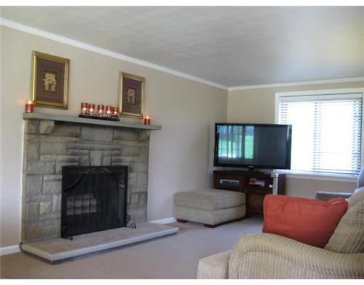 16 Robinhood Road Green Tree, PA 15220 - Photo 6 of 15 Living Room. New neutral high-end carpeting. Stone log-burning fireplace, neutral walls with crown molding, new 2-inch faux wood blinds.