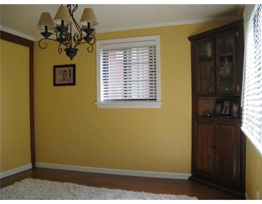 16 Robinhood Road Green Tree, PA 15220 - Photo 8 of 15 Dining Room. Hardwood floors, yellow walls, crown molding, pretty light fixture, 2-inch blinds.