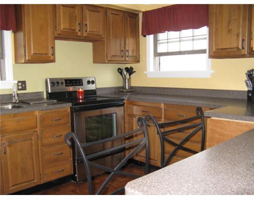16 Robinhood Road Green Tree, PA 15220 - Photo 10 of 15 Kitchen. There s a 1/2 wall betwen the kitchen and dining room with Corian counter and seating for two.