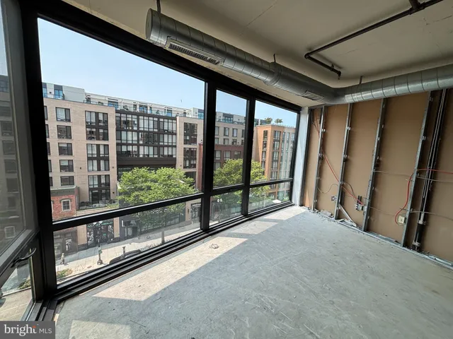 a view of an empty room with a balcony