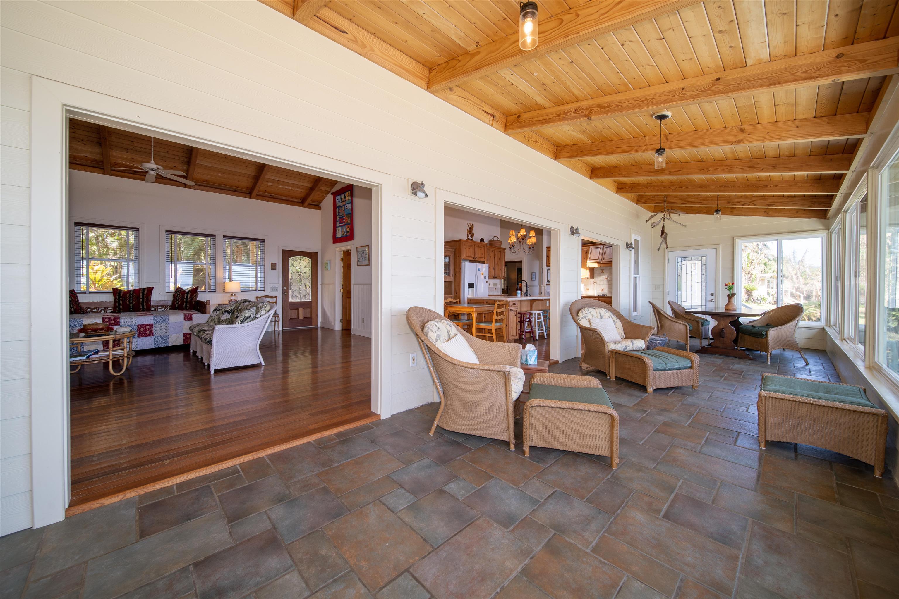 4955 Uakea Road Hana, HI 96713 - Photo 11 of 36 a living room with furniture and a chandelier