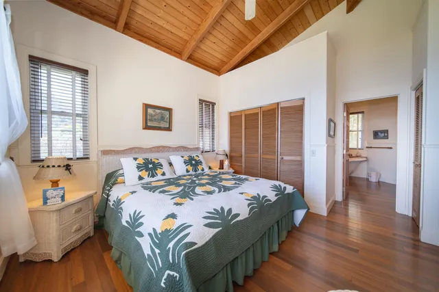 a bedroom with bed and a window