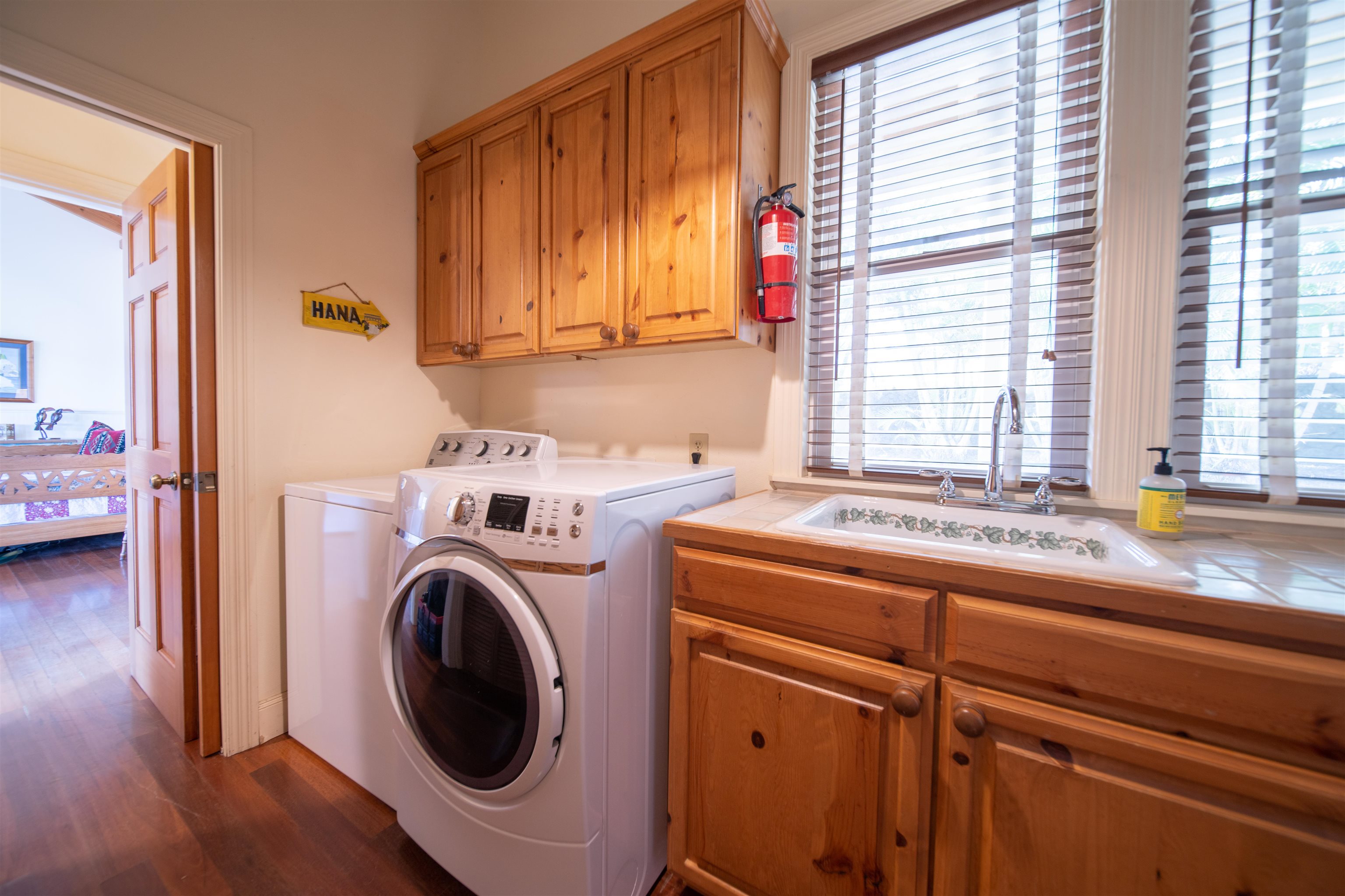 4955 Uakea Road Hana, HI 96713 - Photo 27 of 36 a utility room with dryer and washer