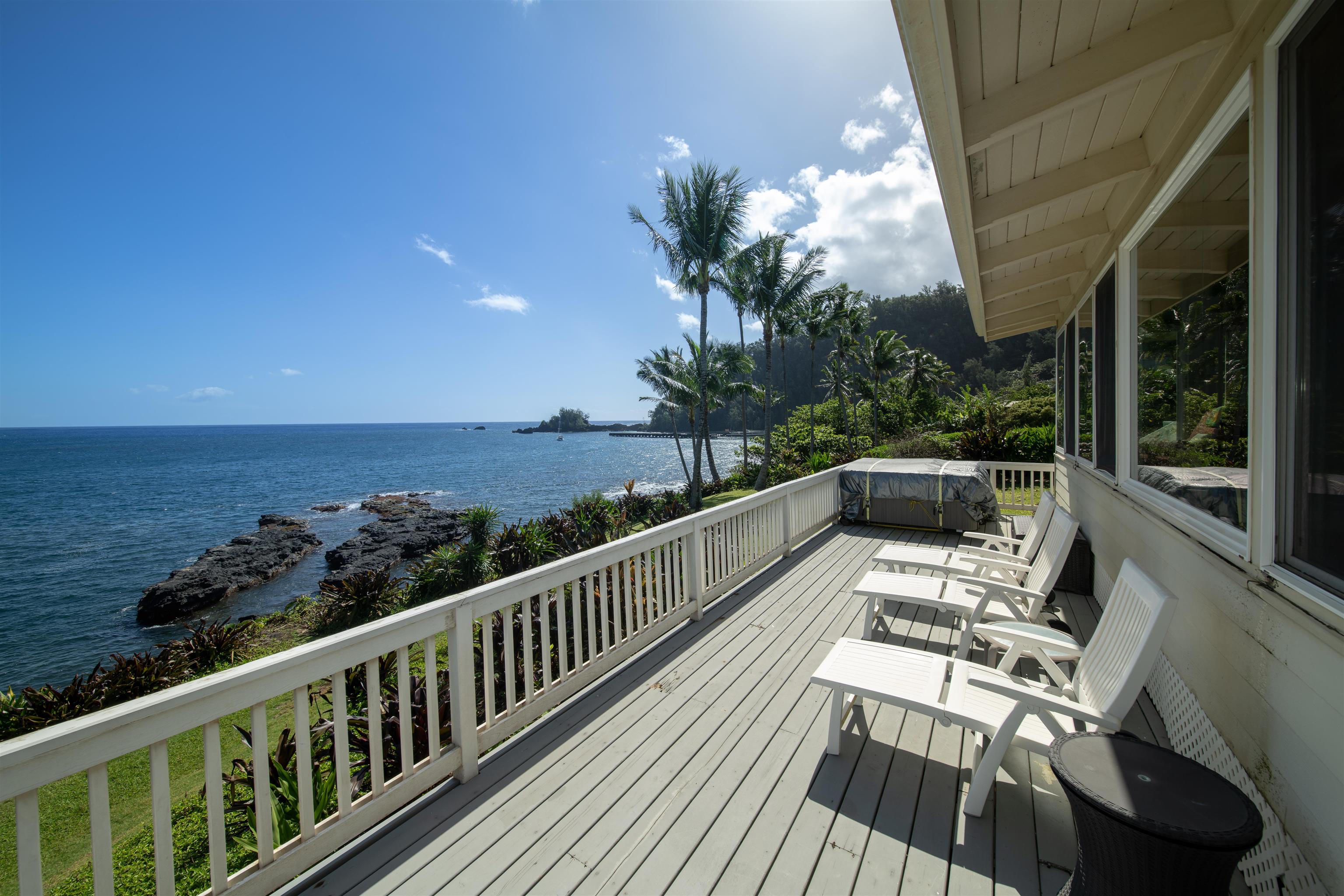 4955 Uakea Road Hana, HI 96713 - Photo 5 of 36 a view of a balcony with chairs