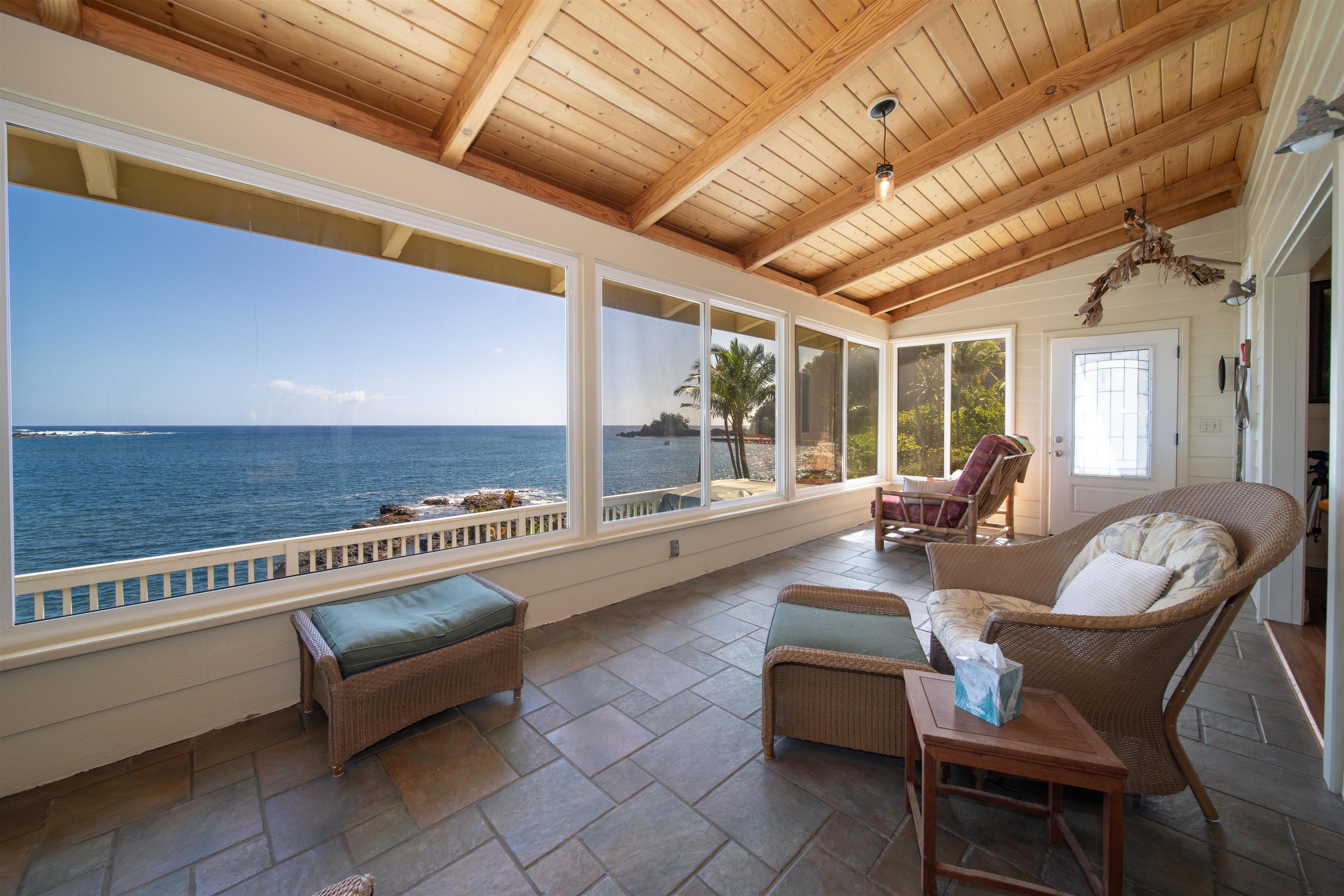 4955 Uakea Road Hana, HI 96713 - Photo 6 of 36 a living room with furniture and a table