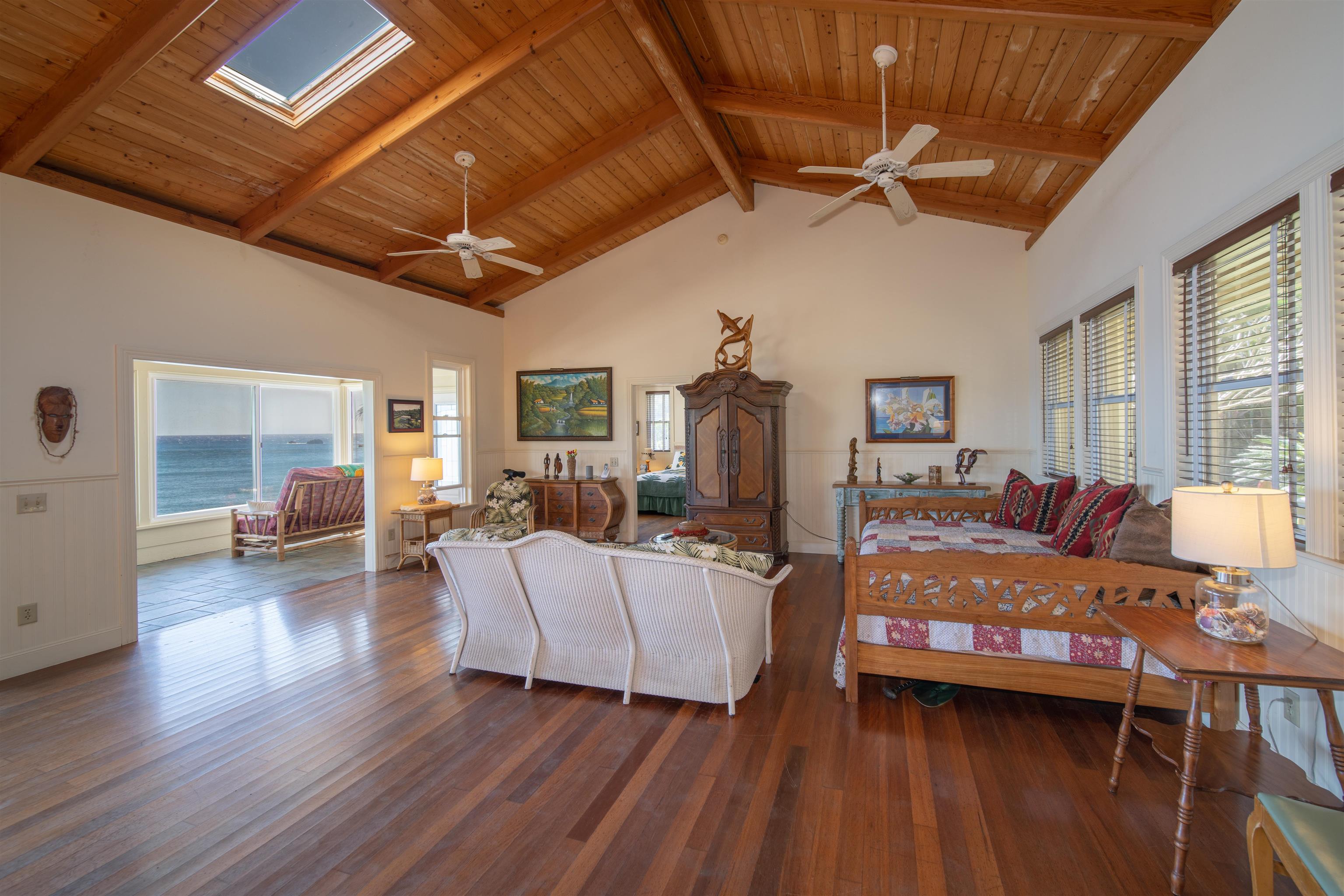 4955 Uakea Road Hana, HI 96713 - Photo 9 of 36 a bedroom with furniture and wooden floor