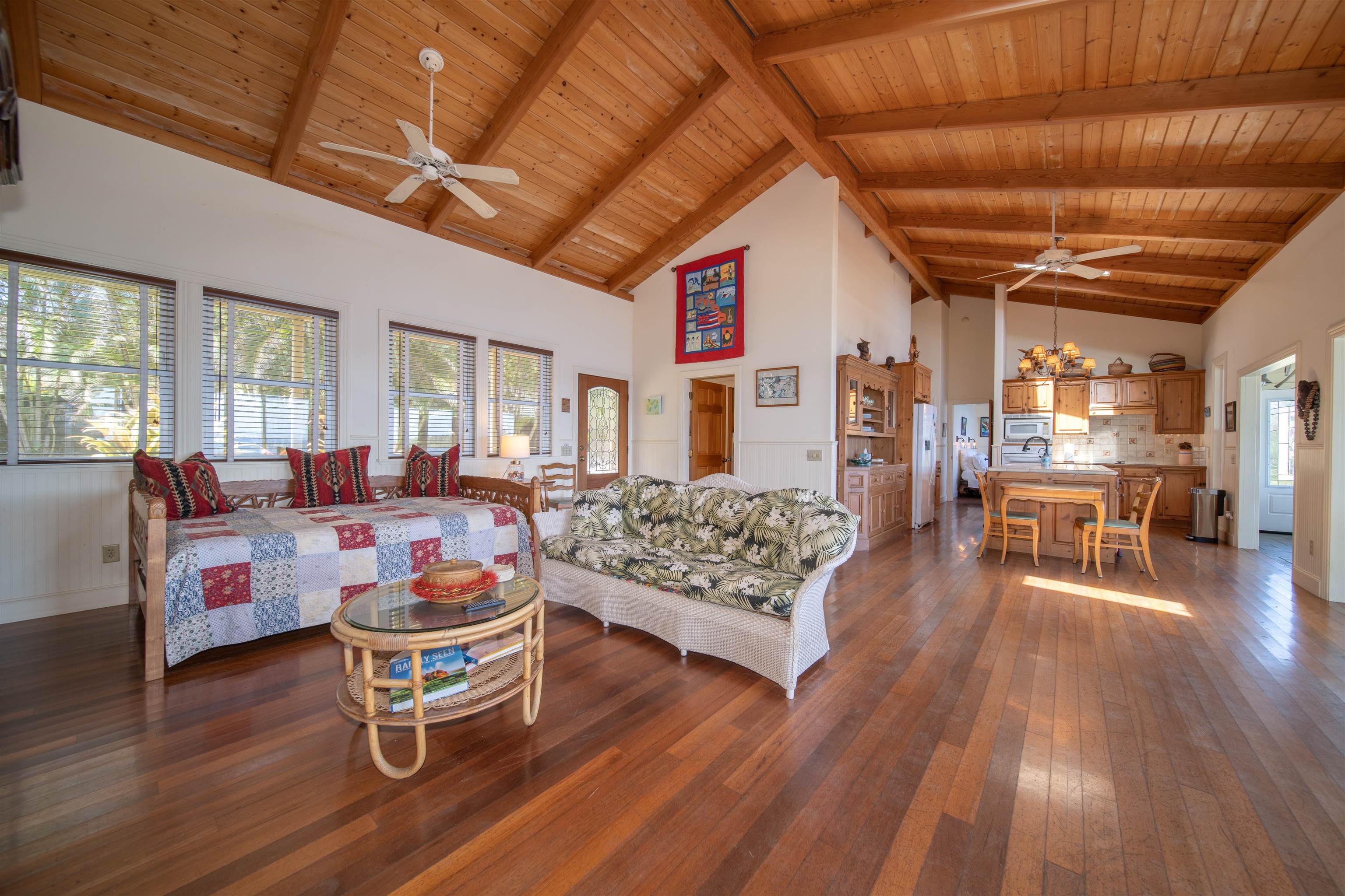 4955 Uakea Road Hana, HI 96713 - Photo 10 of 36 a living room with furniture and wooden floor