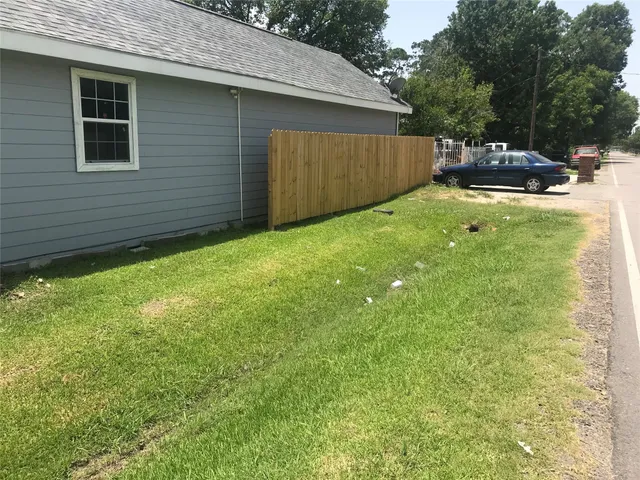 a view of a backyard with a cabin