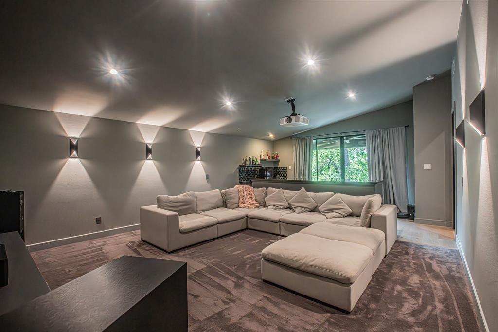 3100 East Melissa Road Melissa, TX 75454 - Photo 17 of 39 Home theater room with vaulted ceiling, recessed lighting, and wood finished floors