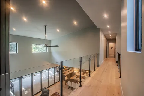 a view of a hallway with a chandelier