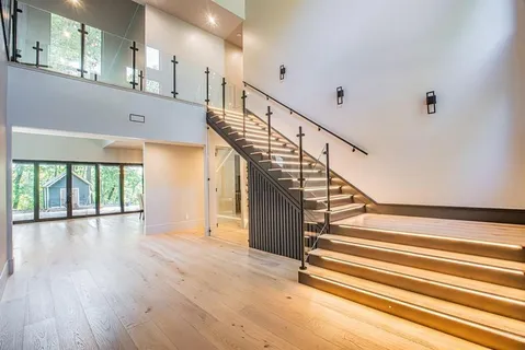 a view of entryway and hall with wooden floor