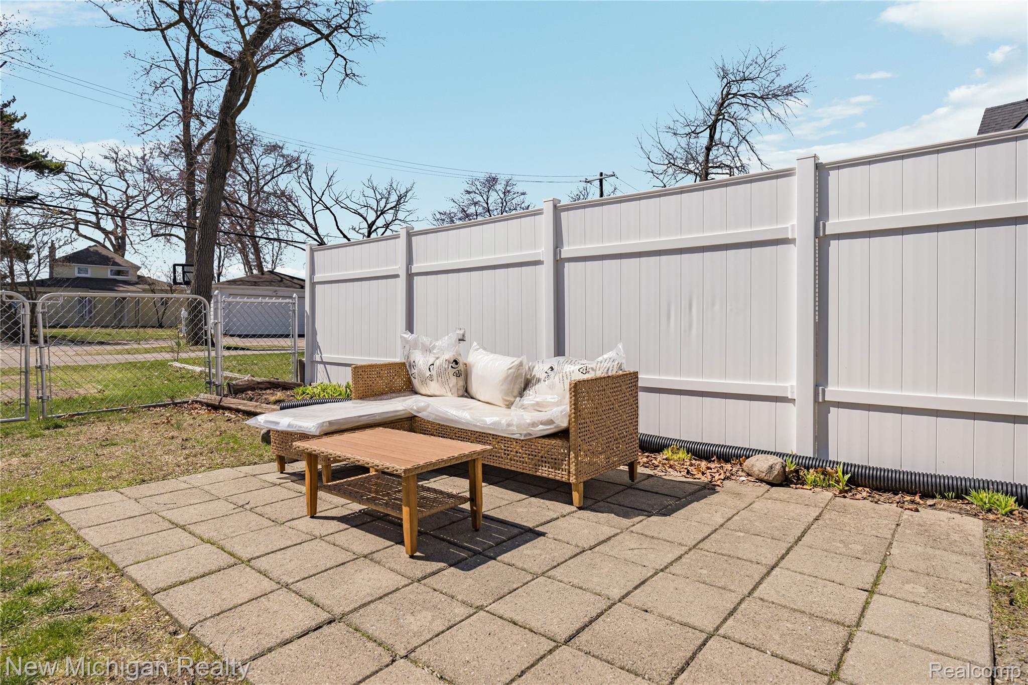 8665 Cooley Lake Road Commerce Township, MI 48382 - Photo 47 of 52 View of patio / terrace featuring a gate