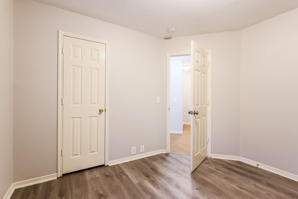 614 Cypresswood Trace Spring, TX 77373 - Photo 14 of 16 an empty room with wooden floor