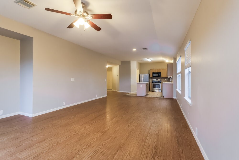 614 Cypresswood Trace Spring, TX 77373 - Photo 3 of 16 a view of a livingroom with a furniture wooden floor and a ceiling fan