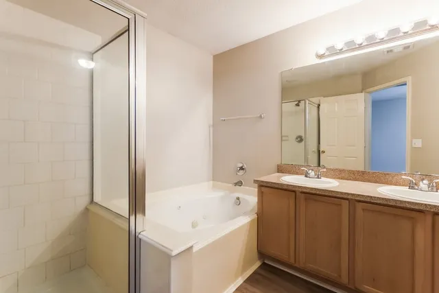 a bathroom with a bathtub and a sink