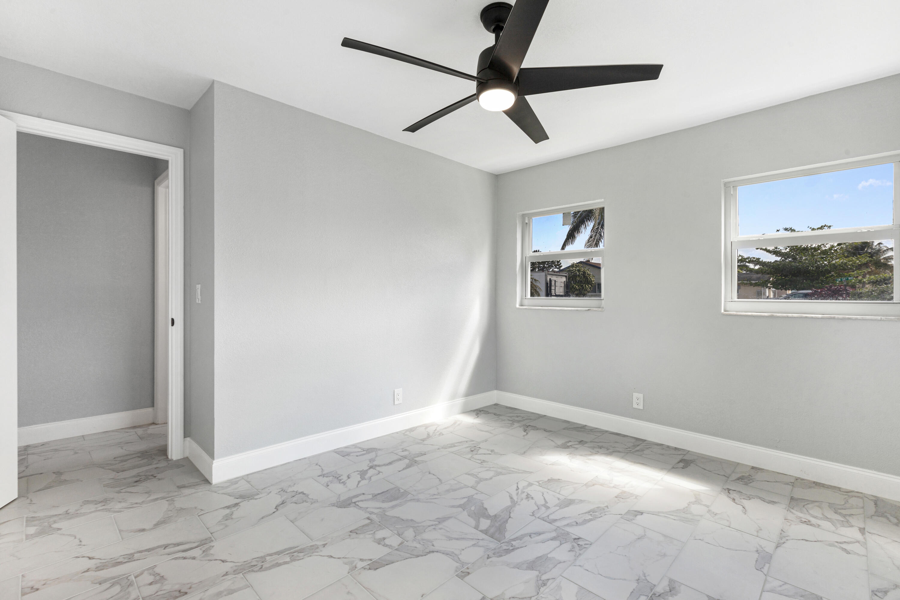 22848 Southwest 54th Way Boca Raton, FL 33433 - Photo 12 of 20 a view of empty room with wooden floor
