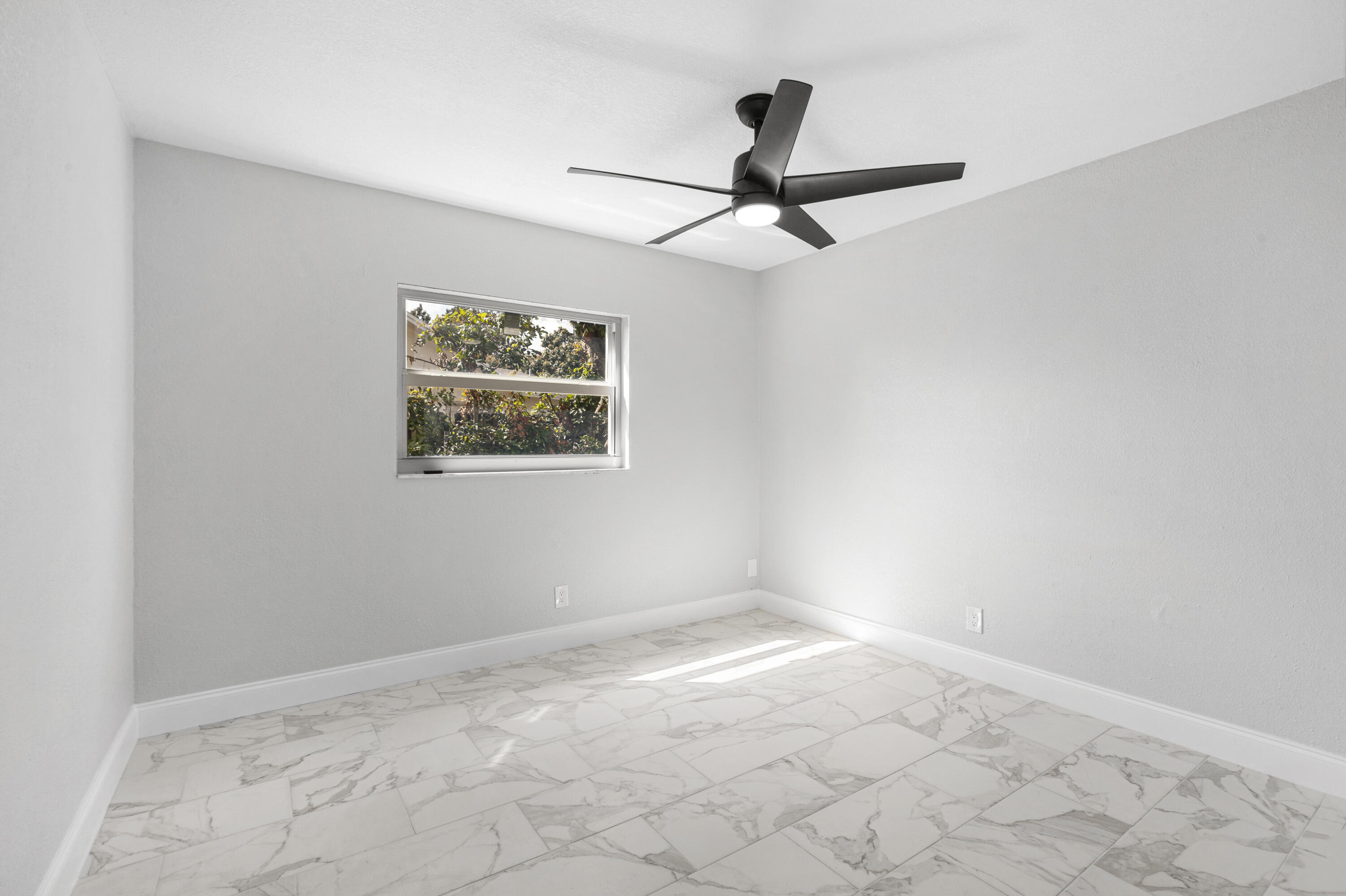 22848 Southwest 54th Way Boca Raton, FL 33433 - Photo 13 of 20 a view of empty room with windows