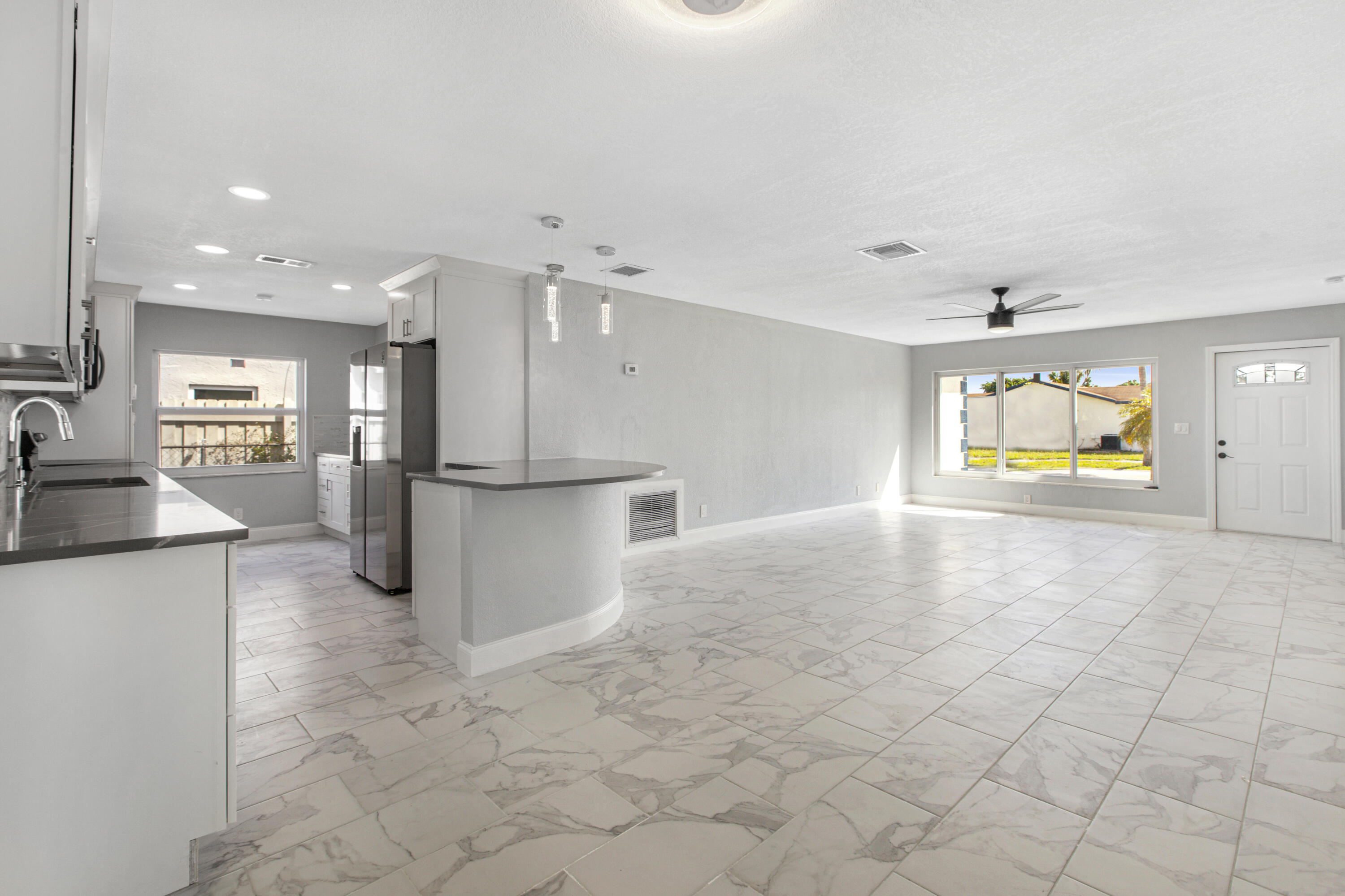 22848 Southwest 54th Way Boca Raton, FL 33433 - Photo 5 of 20 a view of a kitchen with a stove cabinets and a kitchen