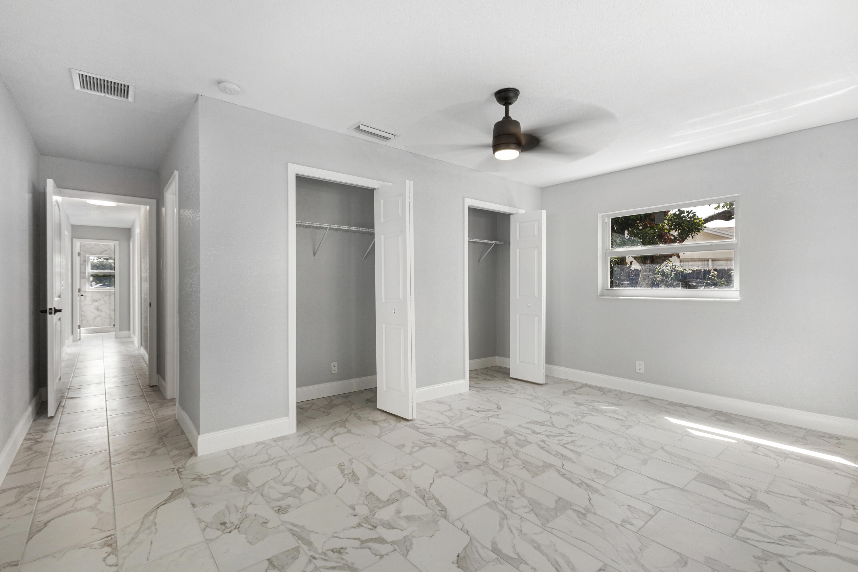 22848 Southwest 54th Way Boca Raton, FL 33433 - Photo 9 of 20 a view of empty room with wooden floor