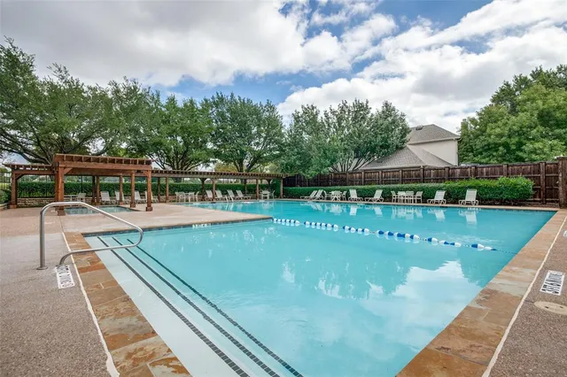 a view of a swimming pool with a patio