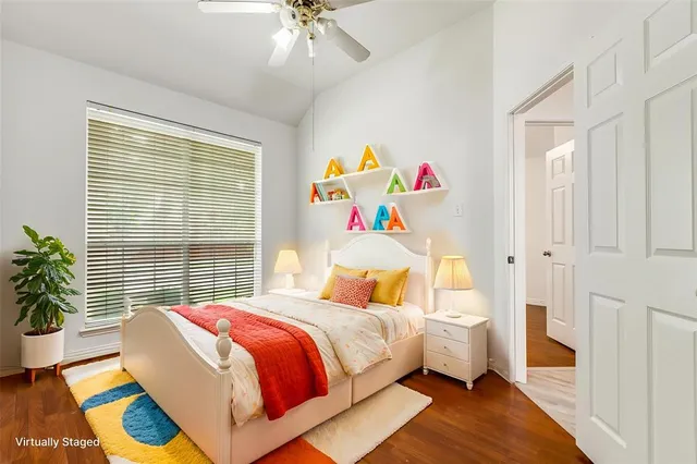 a bedroom with a bed and a window