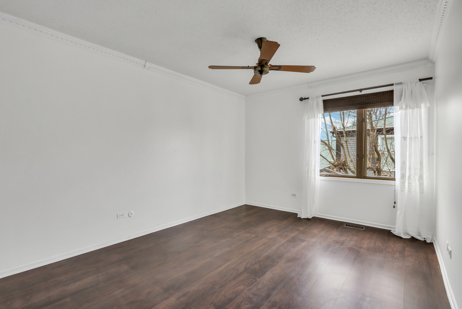 1038 Inverrary Lane Deerfield, IL 60015 - Photo 11 of 19 a view of empty room with wooden floor and fan