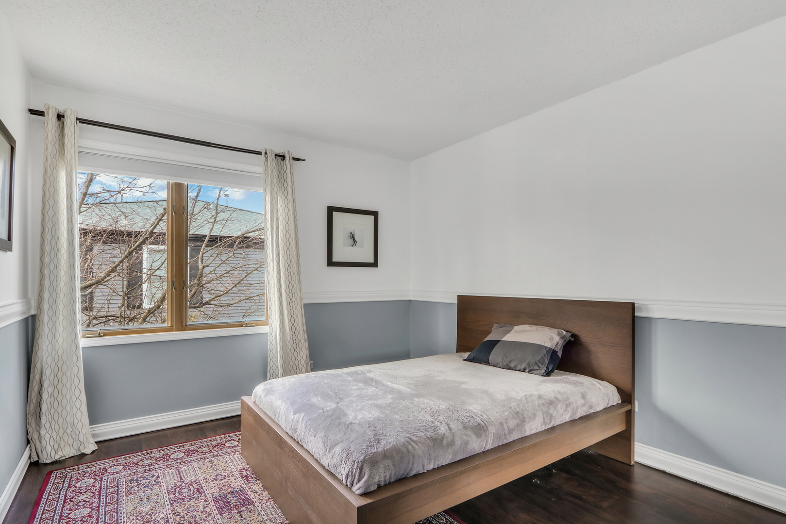 1038 Inverrary Lane Deerfield, IL 60015 - Photo 14 of 19 a bedroom with a bed and window