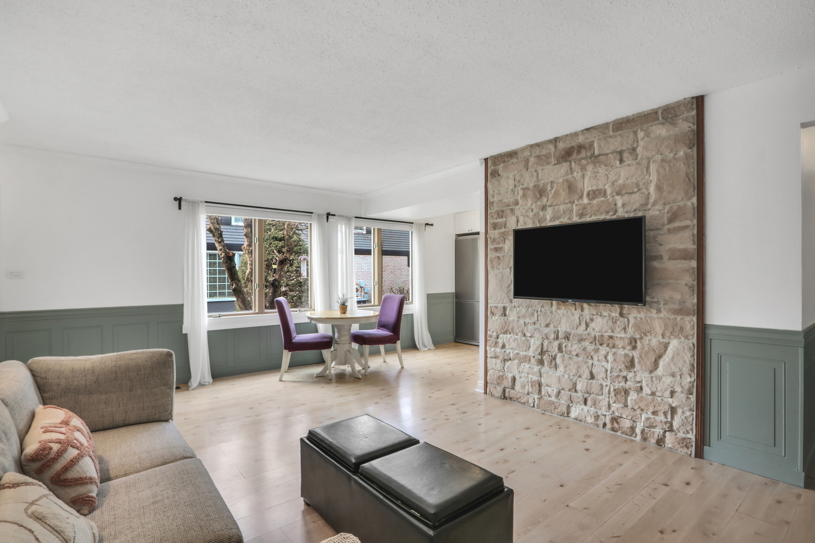 1038 Inverrary Lane Deerfield, IL 60015 - Photo 2 of 19 a living room with furniture a flat screen tv and a fireplace