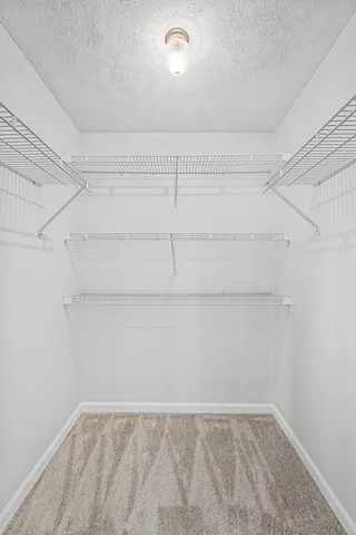 a view of a room with shelf on the wall